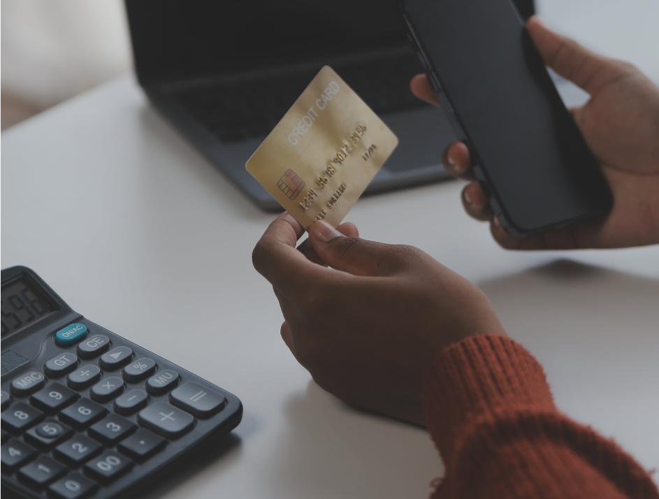 close-up-female-hands-holding-credit-card-smartphone-young-woman-paying-online-using-banking-service-entering-information-shopping-ordering-internet-store-doing-secure-payment-min